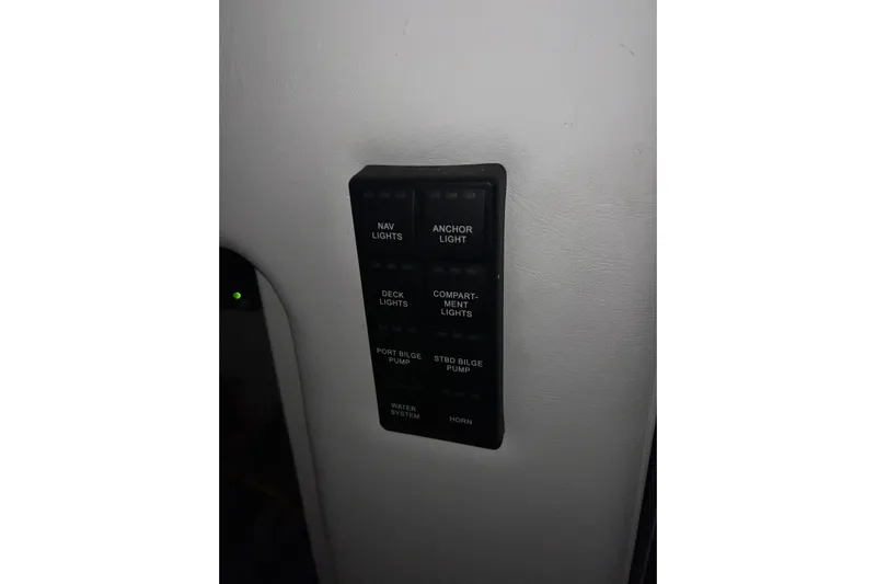  Yacht Photos Pics Control panel on 2025 Concept 27' Open Deck boat, featuring various light and pump switches.