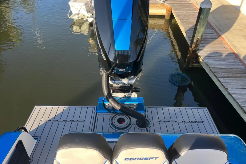  Yacht Photos Pics 2025 Concept 27' Open Deck boat at dock, featuring sleek design and powerful engine.