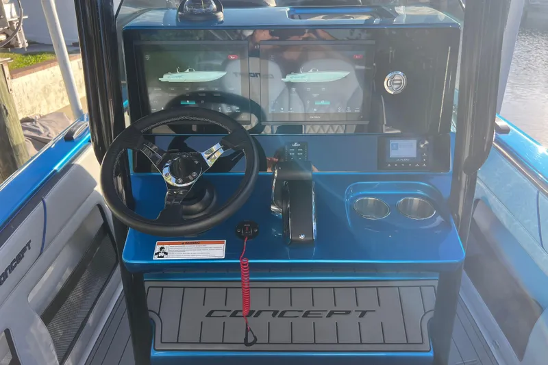  Yacht Photos Pics 2025 Concept 27' Open Deck boat dashboard with steering wheel and digital displays.