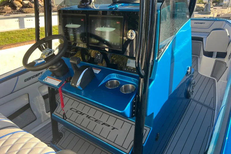 Yacht Photos Pics Interior of 2025 Concept 27' Open Deck boat with modern controls and blue accents.