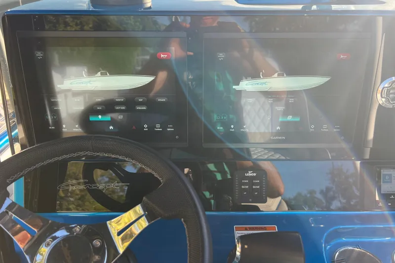  Yacht Photos Pics Steering wheel and dual screens of 2025 Concept 27' Open Deck boat dashboard.