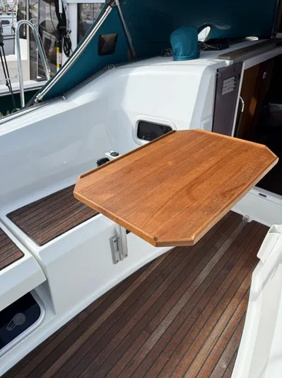 Seaglass Yacht Photos Pics Cockpit of 2019 Jeanneau Sun Odyssey 349 with wooden folding table.