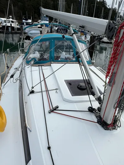 Seaglass Yacht Photos Pics 2019 Jeanneau Sun Odyssey 349 sailboat docked in marina, featuring sleek deck design.