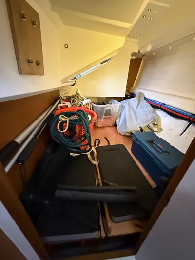 Seaglass Yacht Photos Pics Storage area in a 2019 Jeanneau Sun Odyssey 349 sailboat, featuring ropes and equipment.