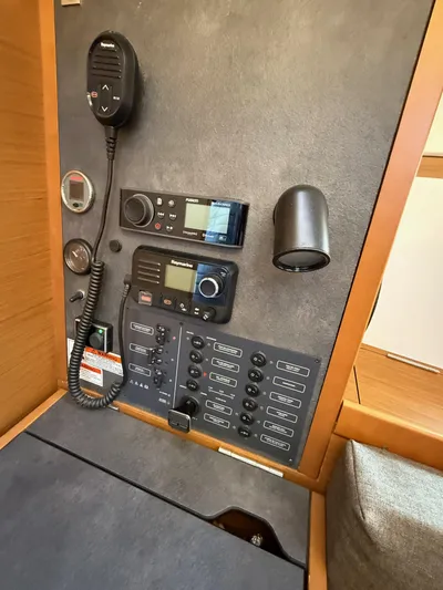 Seaglass Yacht Photos Pics Control panel of 2019 Jeanneau Sun Odyssey 349 sailboat with communication equipment.