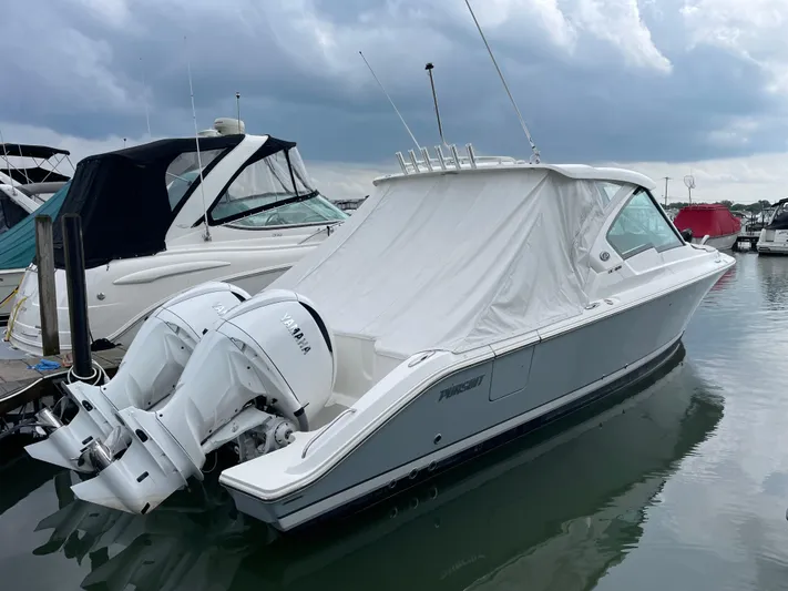  Yacht Photos Pics 2024 Pursuit DC 326 Dual Console boat docked with Yamaha engines.