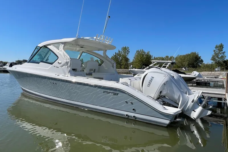  Yacht Photos Pics 2024 Pursuit DC 326 Dual Console boat docked with Yamaha engines.