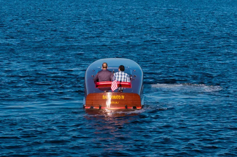  Yacht Photos Pics Custom 30 Gentleman's Racer boat from 1998 on open water, rear view.