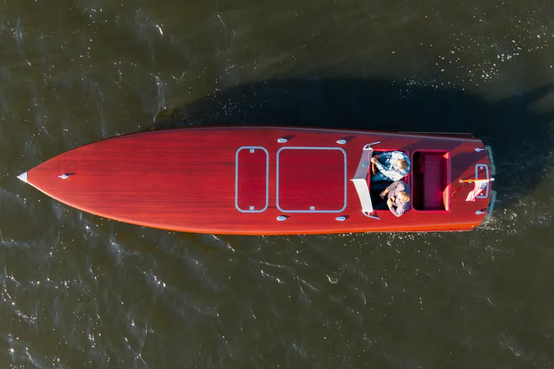  Yacht Photos Pics Overhead view of a 1998 Custom 30 Gentleman's Racer on water.