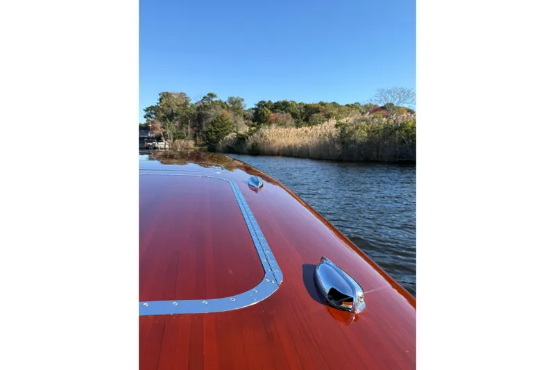  Yacht Photos Pics Custom 1998 30 Gentleman's Racer on serene water with lush greenery backdrop.
