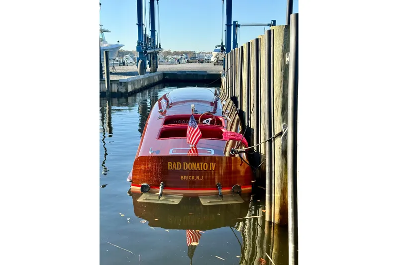  Yacht Photos Pics Custom 1998 30 Gentleman's Racer boat docked, featuring polished wood and American flag.