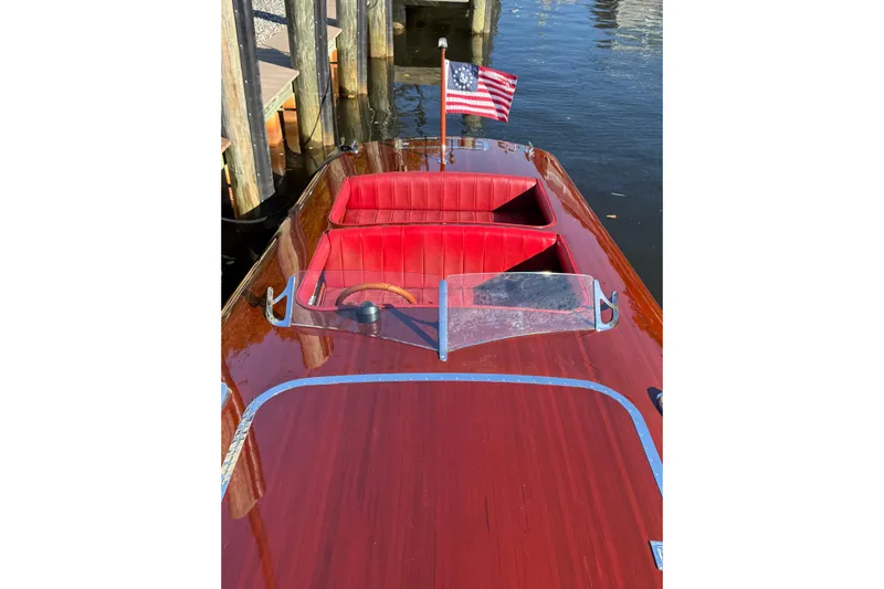  Yacht Photos Pics Custom 1998 30 Gentleman's Racer with polished wood finish and red interior, docked by water.