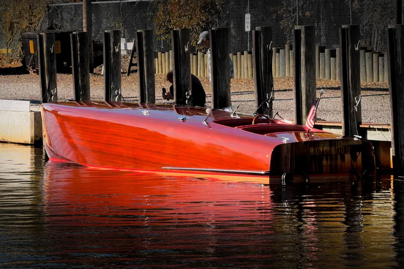  Yacht Photos Pics Custom 1998 30 Gentleman's Racer boat docked, reflecting sunlight on water.
