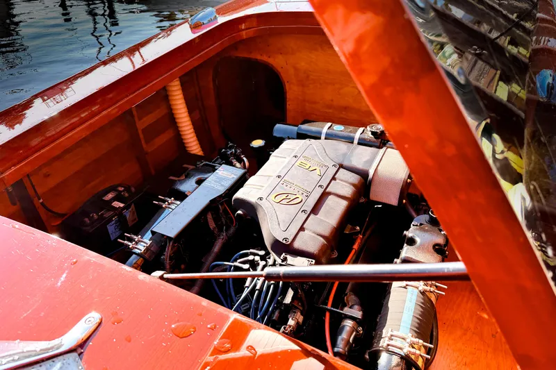  Yacht Photos Pics Engine compartment of a 1998 Custom 30 Gentleman's Racer, showcasing detailed mechanics and craftsmanship.