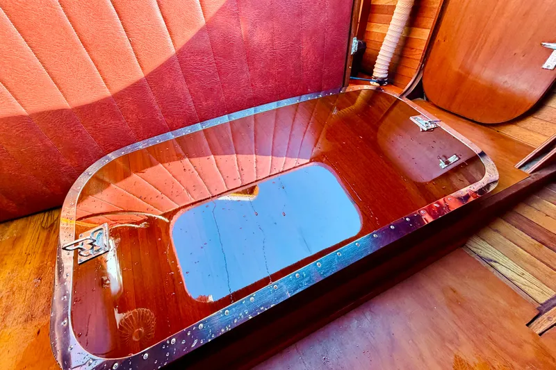  Yacht Photos Pics Interior of 1998 Custom 30 Gentleman's Racer with polished wood and red upholstery.