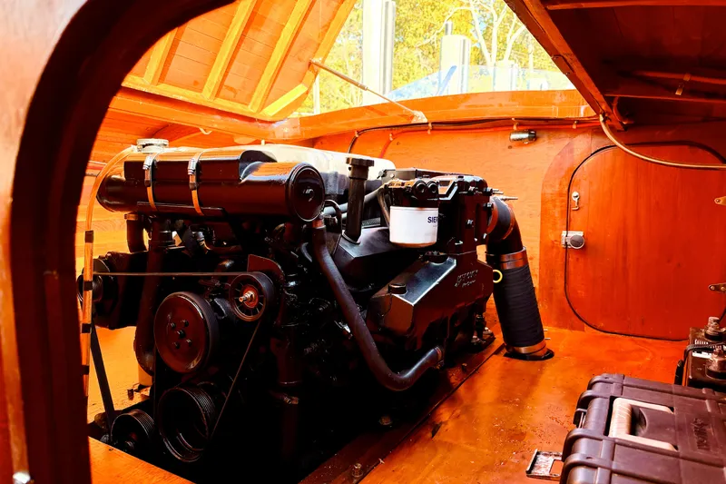  Yacht Photos Pics Engine compartment of 1998 Custom 30 Gentleman's Racer with wooden interior detailing.