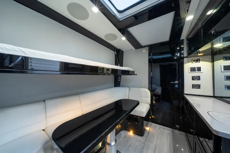  Yacht Photos Pics Luxurious interior of 2021 HCB 65 Estrella yacht with modern seating and sleek design.