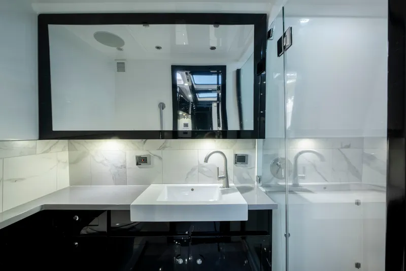  Yacht Photos Pics Luxurious bathroom interior on 2021 HCB 65 Estrella yacht, featuring modern sink and elegant design.