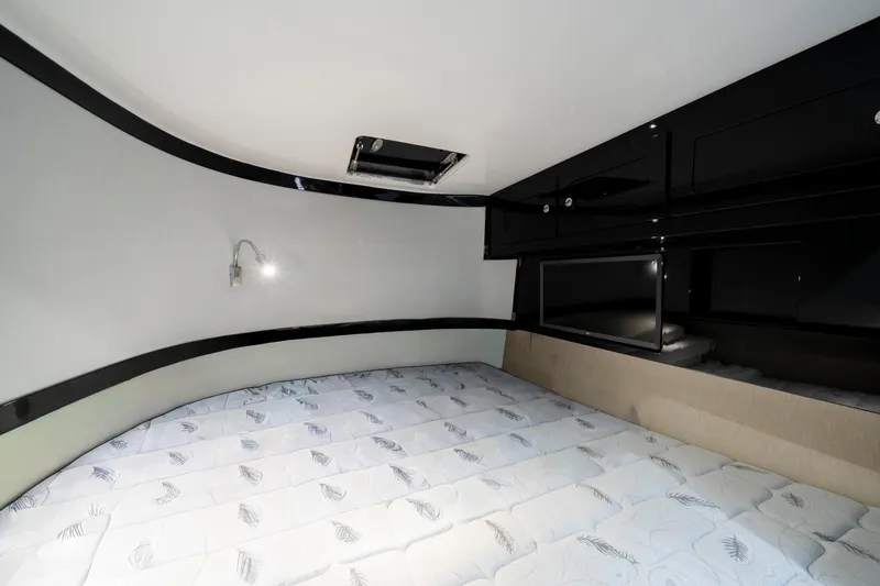  Yacht Photos Pics Interior cabin of 2021 HCB 65 Estrella with bed and storage cabinets.