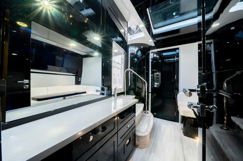  Yacht Photos Pics Luxurious interior of 2021 HCB 65 Estrella yacht with sleek black and white design.