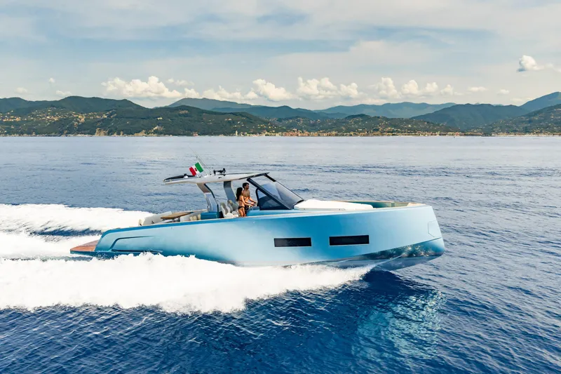 Pardo 43 Yacht Photos Pics 2026 Pardo Yachts 43 cruising on open water with scenic mountain backdrop.