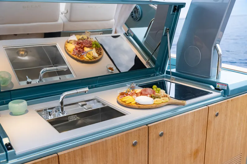 Pardo 43 Yacht Photos Pics Luxurious Pardo Yachts 43 kitchen with charcuterie board, sink, and stove, 2026 model.