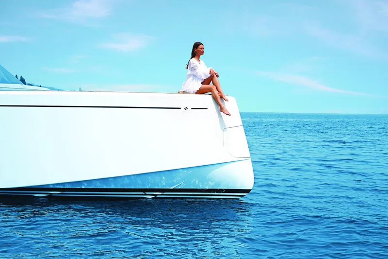 Pardo 43 Yacht Photos Pics Woman relaxing on 2026 Pardo Yachts 43, enjoying serene ocean view.