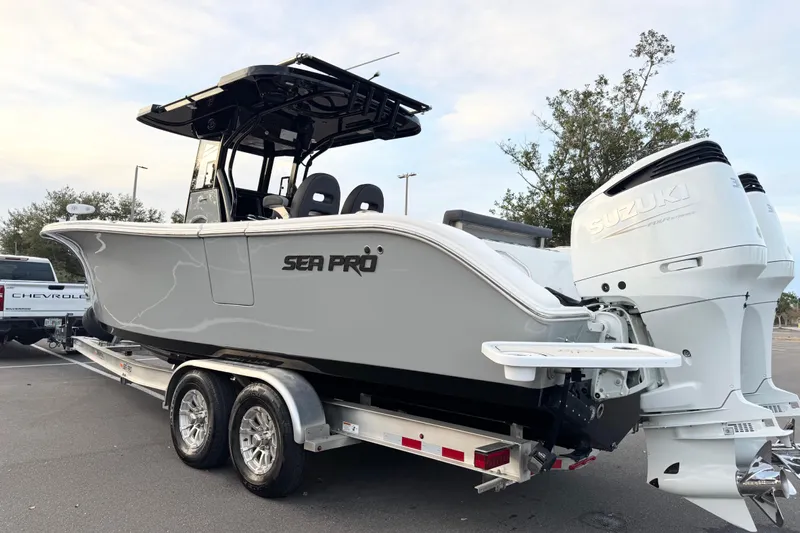  Yacht Photos Pics 2024 Sea Pro 292 DLX boat on trailer with dual Suzuki outboard engines.