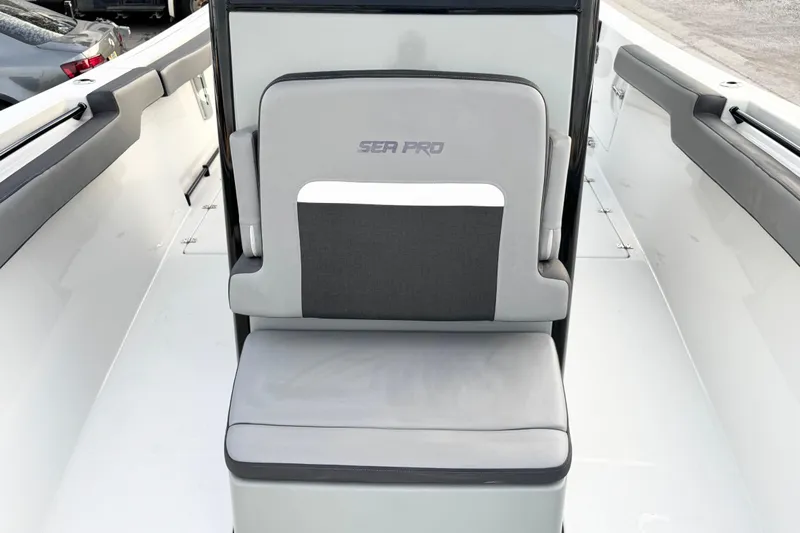  Yacht Photos Pics 2024 Sea Pro 292 DLX boat seat, featuring sleek gray upholstery and modern design.