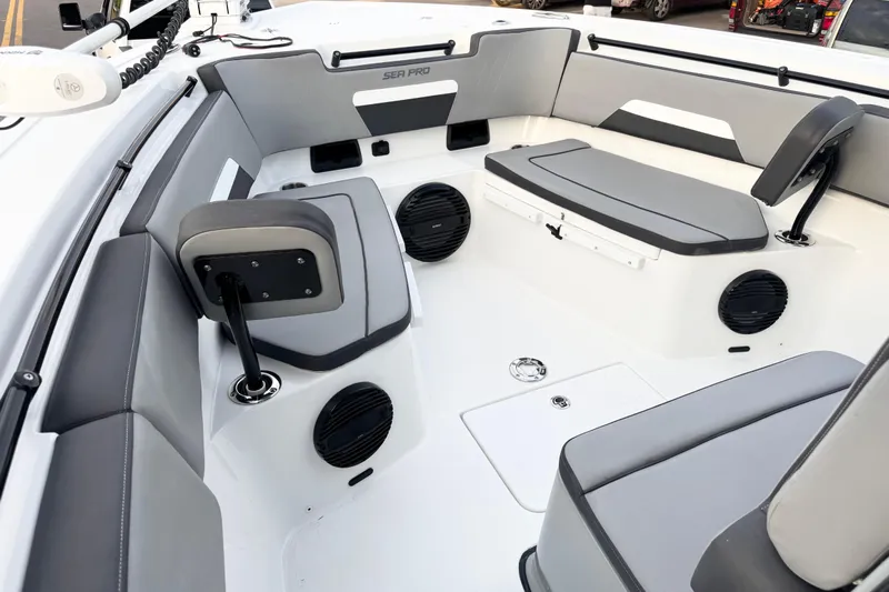  Yacht Photos Pics 2024 Sea Pro 292 DLX boat interior with gray seating and built-in speakers.