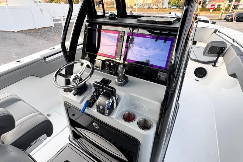  Yacht Photos Pics 2024 Sea Pro 292 DLX boat cockpit with dual screens and modern controls.