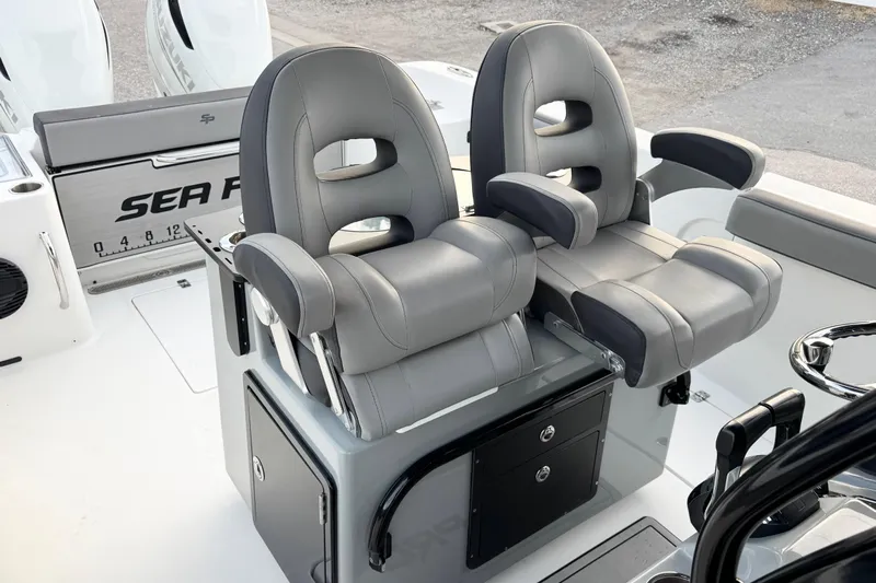  Yacht Photos Pics 2024 Sea Pro 292 DLX boat with dual gray captain's chairs and console.