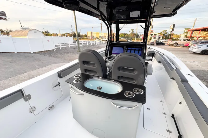  Yacht Photos Pics 2024 Sea Pro 292 DLX boat interior with helm, seating, and control panel.