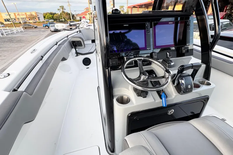 Yacht Photos Pics 2024 Sea Pro 292 DLX boat cockpit with modern controls and dual screens.