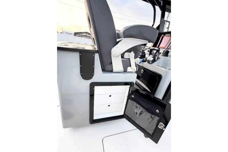  Yacht Photos Pics 2024 Sea Pro 292 DLX boat interior with storage compartment and seating.