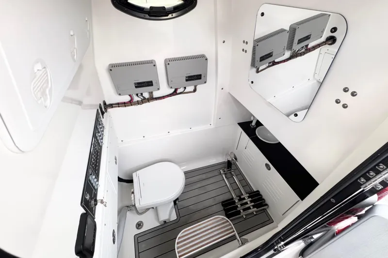  Yacht Photos Pics 2024 Sea Pro 292 DLX boat interior with modern bathroom amenities and sleek design.