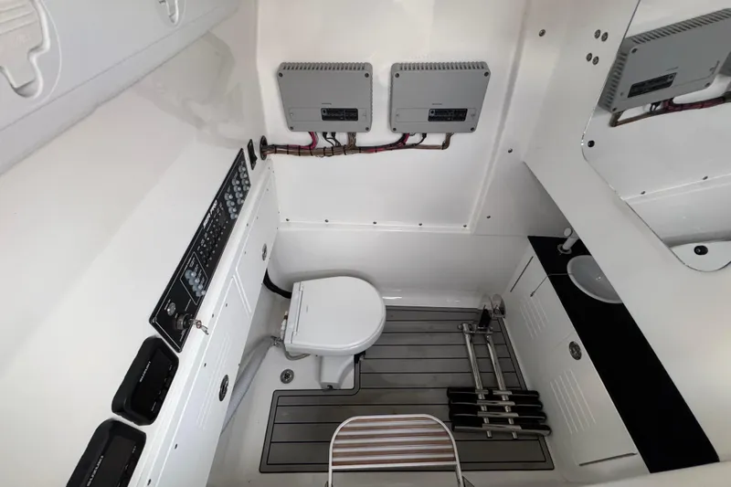  Yacht Photos Pics 2024 Sea Pro 292 DLX boat interior with toilet and control panel.