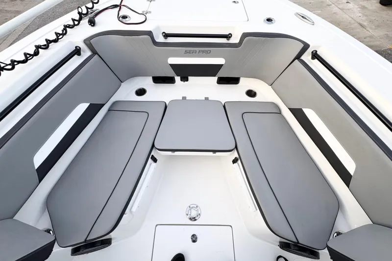  Yacht Photos Pics 2024 Sea Pro 292 DLX boat interior with gray seating and modern design.