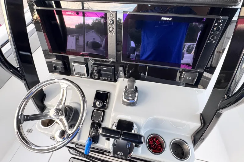  Yacht Photos Pics 2024 Sea Pro 292 DLX boat dashboard with dual Simrad displays and modern controls.