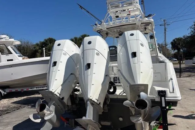 Yacht Photos Pics 2008 Everglades 350LX boat with triple outboard engines, docked outdoors.