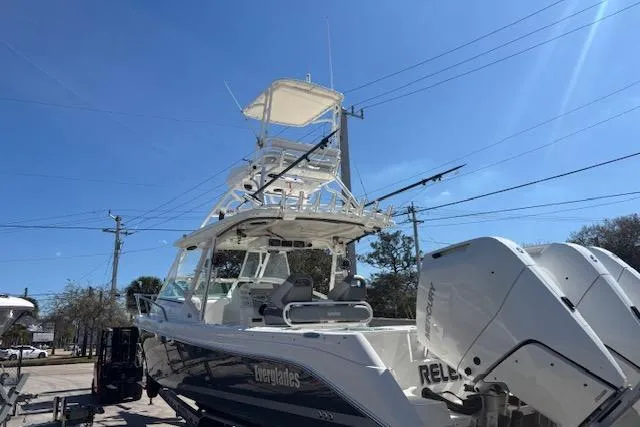  Yacht Photos Pics 2008 Everglades 350LX boat with dual engines, docked under clear blue sky.