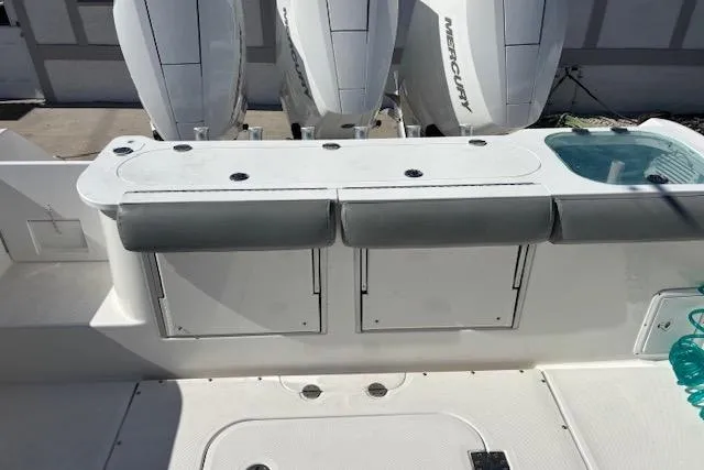  Yacht Photos Pics 2008 Everglades 350LX boat deck with Mercury engines and storage compartments.