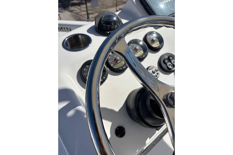 Yacht Photos Pics Steering wheel and dashboard of 2008 Everglades 350LX boat, featuring gauges and controls.