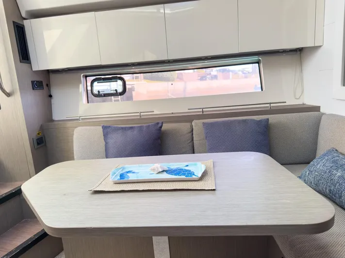  Yacht Photos Pics Interior of 2021 Beneteau Gran Turismo 41 yacht with modern seating and table.
