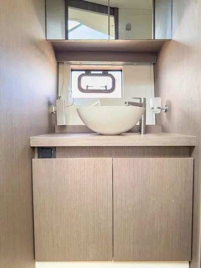  Yacht Photos Pics Modern bathroom in 2021 Beneteau Gran Turismo 41 yacht with sleek sink and mirror.
