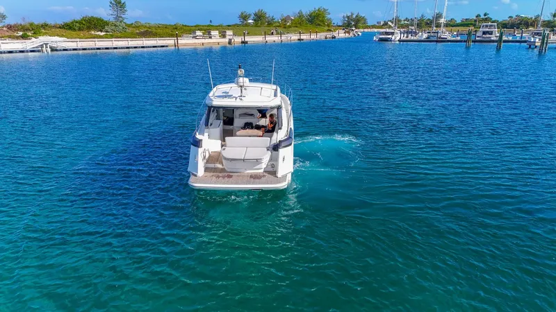  Yacht Photos Pics 2021 Beneteau Gran Turismo 41 yacht cruising in clear blue waters.