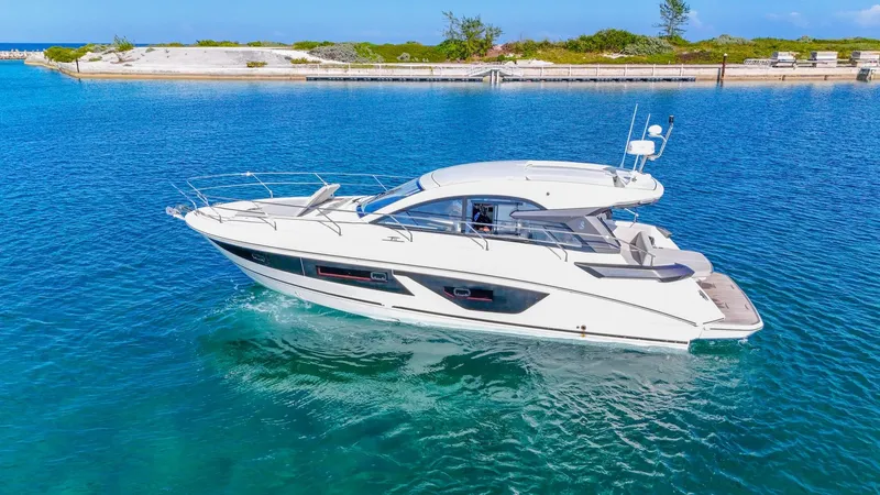  Yacht Photos Pics 2021 Beneteau Gran Turismo 41 yacht cruising in clear blue waters.