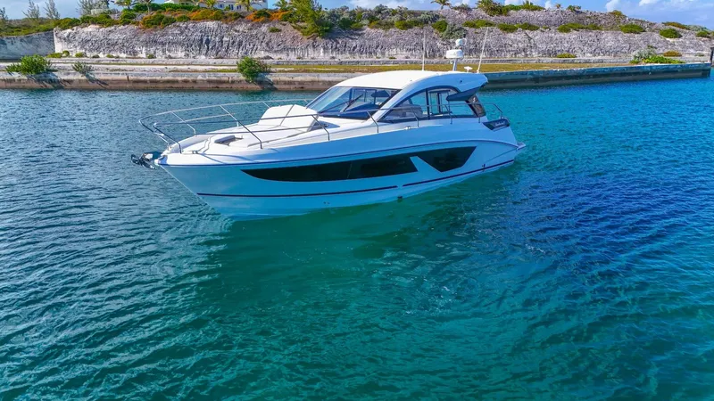  Yacht Photos Pics 2021 Beneteau Gran Turismo 41 yacht cruising in clear blue waters.