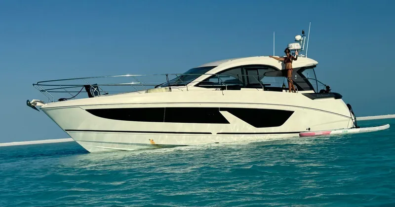  Yacht Photos Pics 2021 Beneteau Gran Turismo 41 yacht cruising on clear blue water.