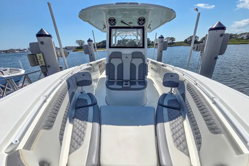  Yacht Photos Pics 2022 Sea Pro 320 DLX Offshore boat interior with luxurious seating and water view.